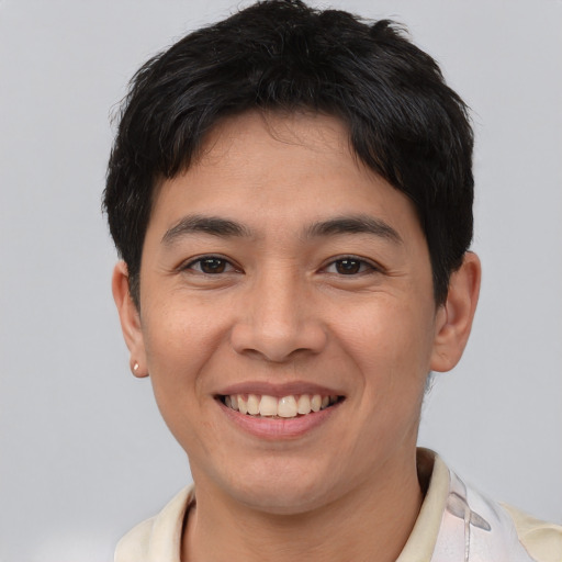 Joyful asian young-adult male with short  brown hair and brown eyes
