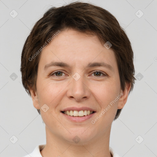 Joyful white young-adult female with short  brown hair and grey eyes