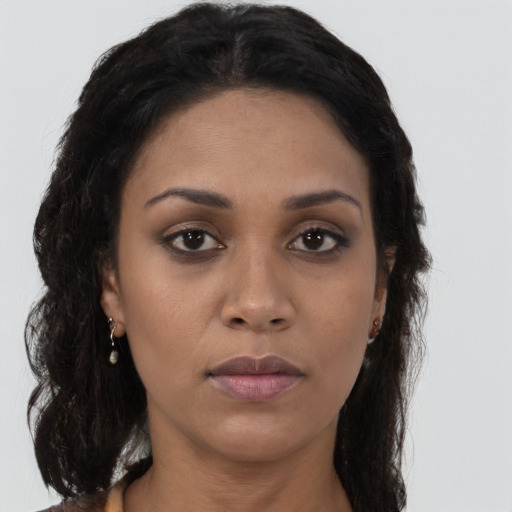 Neutral black young-adult female with long  brown hair and brown eyes