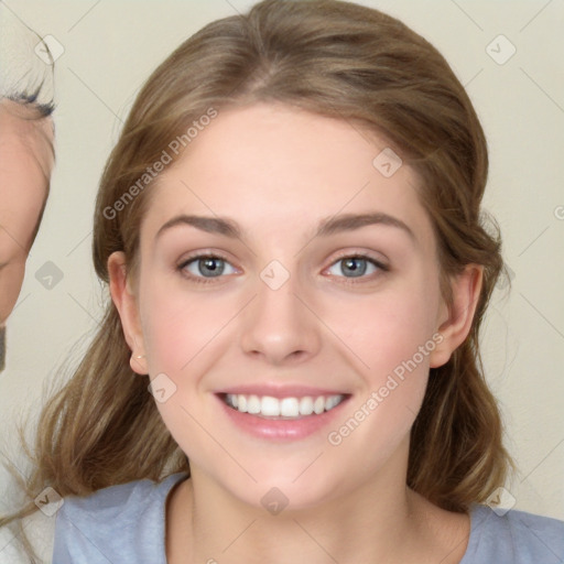 Joyful white young-adult female with medium  brown hair and blue eyes