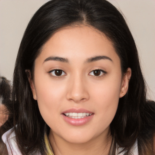 Joyful white young-adult female with long  brown hair and brown eyes