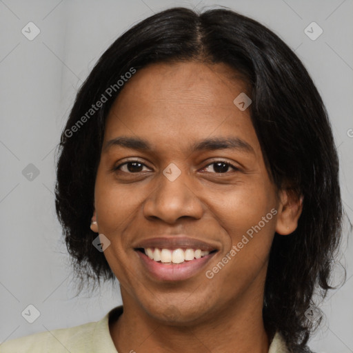 Joyful black young-adult female with medium  black hair and brown eyes