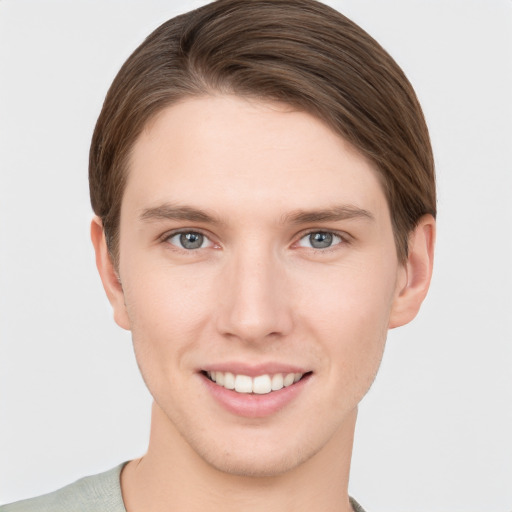 Joyful white young-adult female with short  brown hair and grey eyes