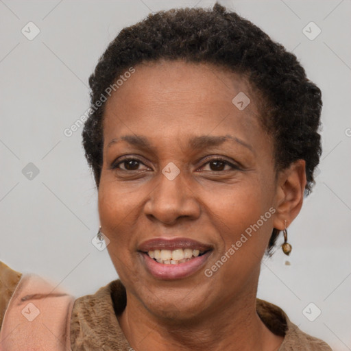 Joyful latino adult female with short  brown hair and brown eyes