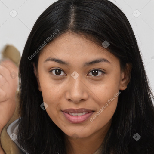 Joyful latino young-adult female with long  brown hair and brown eyes