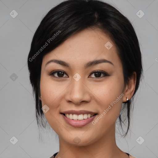 Joyful asian young-adult female with medium  black hair and brown eyes