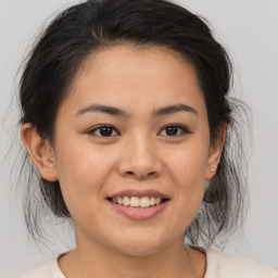 Joyful asian young-adult female with medium  brown hair and brown eyes