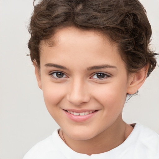 Joyful white child female with short  brown hair and brown eyes