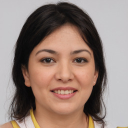 Joyful white young-adult female with medium  brown hair and brown eyes