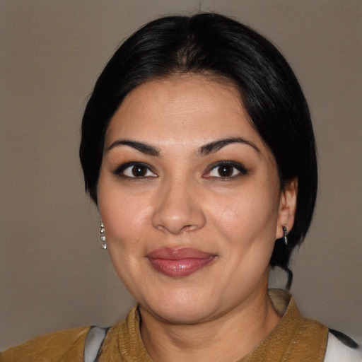 Joyful latino young-adult female with medium  black hair and brown eyes