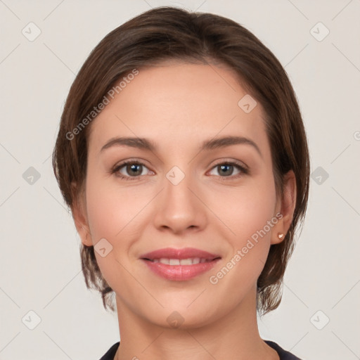 Joyful white young-adult female with medium  brown hair and grey eyes