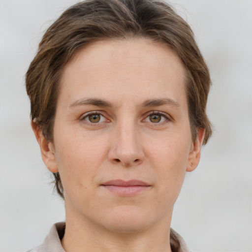 Joyful white adult female with short  brown hair and brown eyes