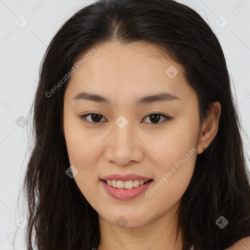 Joyful asian young-adult female with long  brown hair and brown eyes