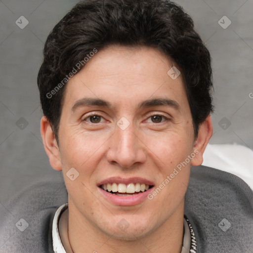 Joyful white adult male with short  brown hair and brown eyes