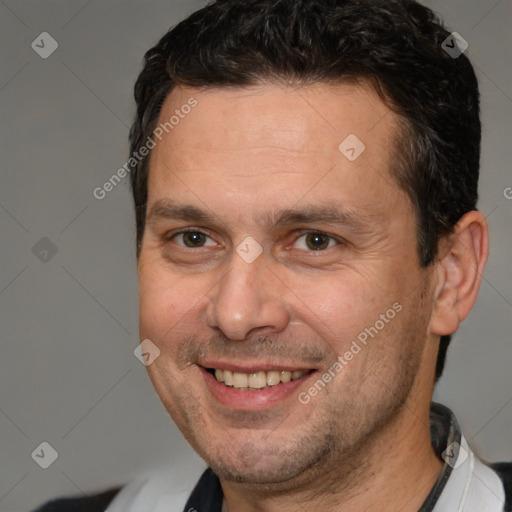 Joyful white adult male with short  brown hair and brown eyes