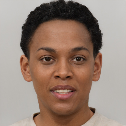 Joyful black young-adult female with short  brown hair and brown eyes