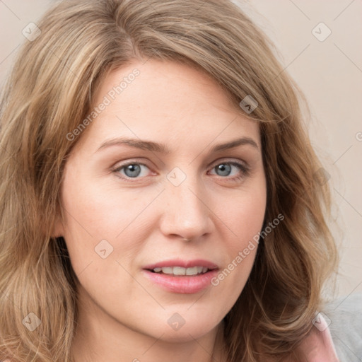 Joyful white young-adult female with long  brown hair and blue eyes