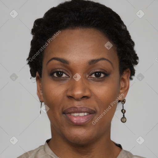 Joyful black adult female with short  black hair and brown eyes