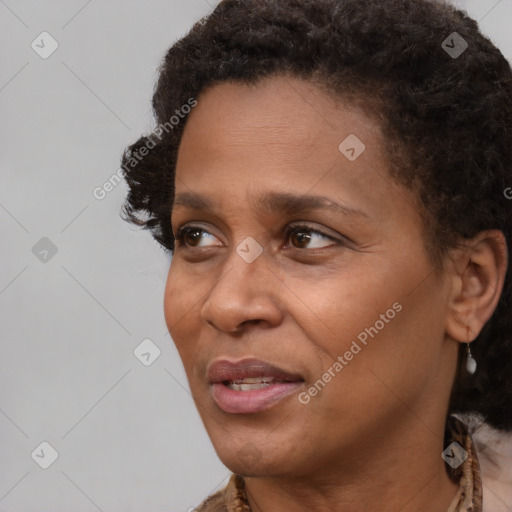 Joyful black adult female with short  brown hair and brown eyes