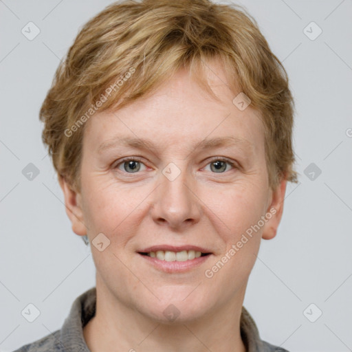 Joyful white adult male with short  brown hair and grey eyes