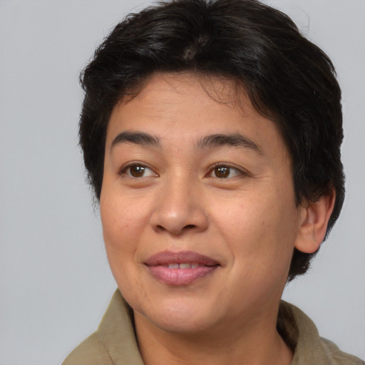 Joyful asian adult female with medium  brown hair and brown eyes