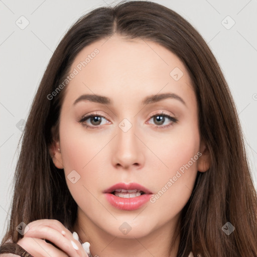 Neutral white young-adult female with long  brown hair and brown eyes