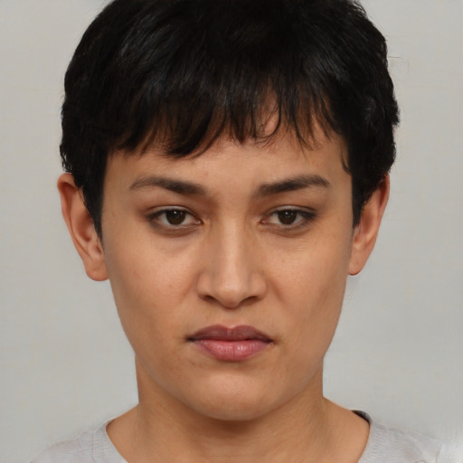 Joyful asian young-adult female with short  brown hair and brown eyes