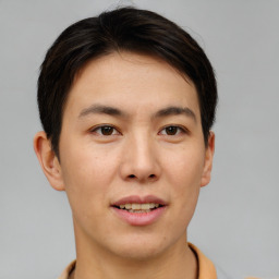 Joyful asian young-adult male with short  brown hair and brown eyes