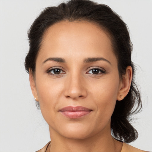 Joyful white young-adult female with medium  brown hair and brown eyes