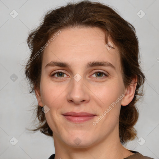 Joyful white young-adult female with medium  brown hair and green eyes