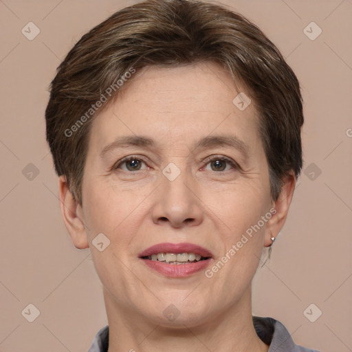 Joyful white adult female with short  brown hair and brown eyes