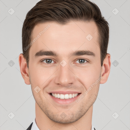 Joyful white young-adult male with short  brown hair and brown eyes