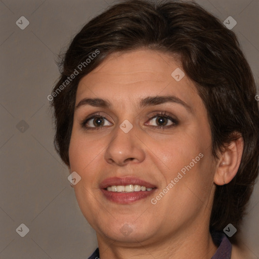 Joyful white adult female with medium  brown hair and brown eyes