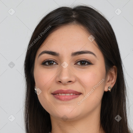 Joyful latino young-adult female with long  brown hair and brown eyes