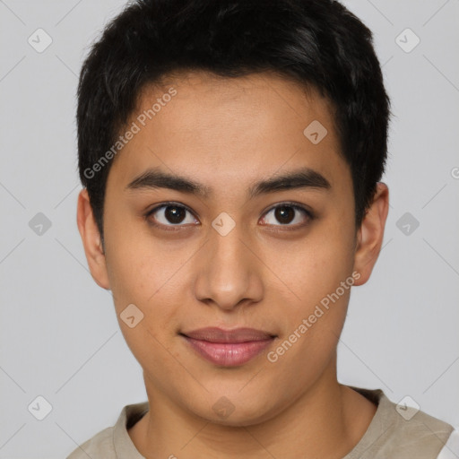 Joyful latino young-adult male with short  brown hair and brown eyes