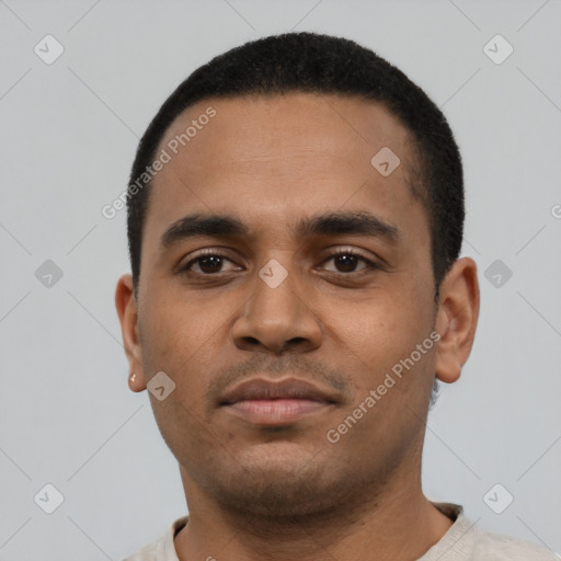 Neutral latino young-adult male with short  black hair and brown eyes