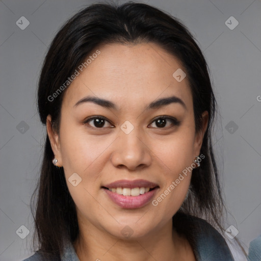 Joyful latino young-adult female with medium  brown hair and brown eyes