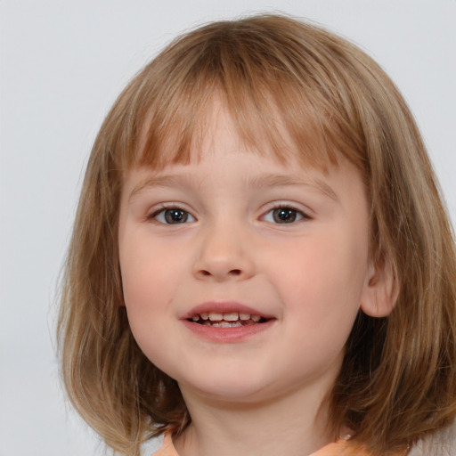 Joyful white child female with medium  brown hair and brown eyes