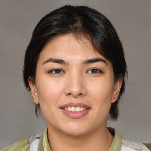 Joyful white young-adult female with medium  brown hair and brown eyes