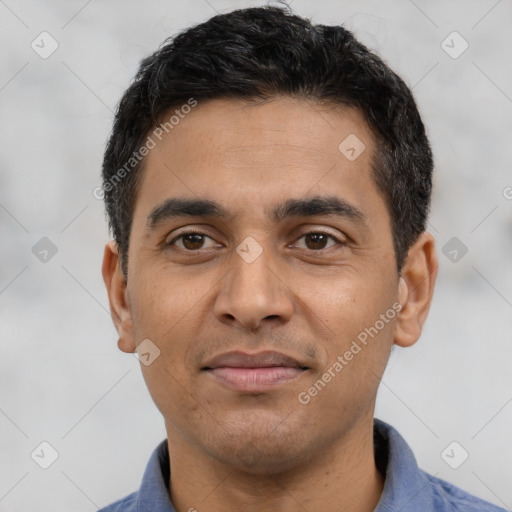 Joyful latino young-adult male with short  black hair and brown eyes