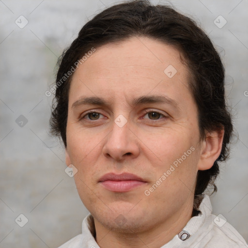 Joyful white adult female with short  brown hair and brown eyes