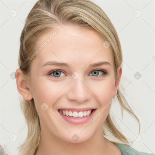 Joyful white young-adult female with long  brown hair and blue eyes