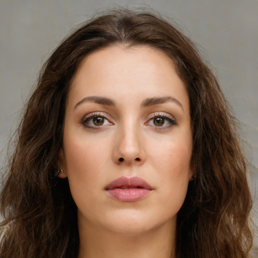 Neutral white young-adult female with long  brown hair and green eyes