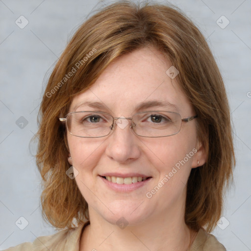 Joyful white adult female with medium  brown hair and blue eyes