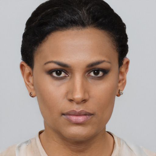 Neutral latino young-adult female with short  black hair and brown eyes