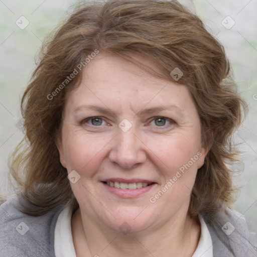 Joyful white adult female with medium  brown hair and blue eyes