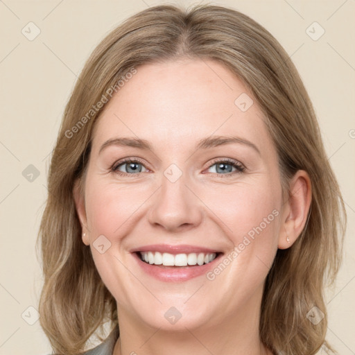 Joyful white young-adult female with medium  brown hair and green eyes