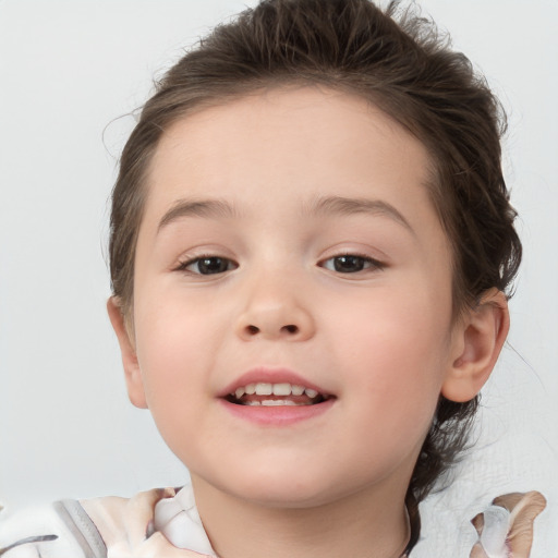 Joyful white child female with short  brown hair and brown eyes