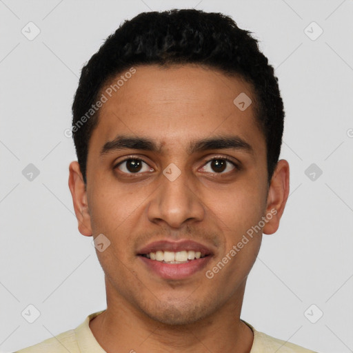 Joyful latino young-adult male with short  brown hair and brown eyes