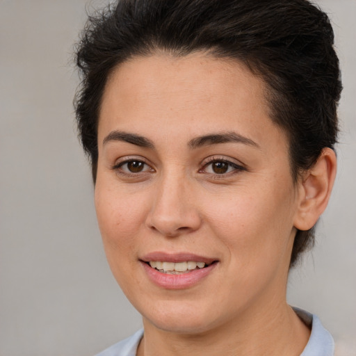 Joyful white young-adult female with short  brown hair and brown eyes